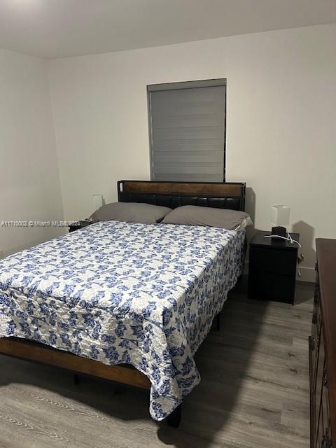 74 Pelican Lane, Unit 1 Big Pine Key, FL 33043 - Photo 4 of 23 a bedroom with a bed and a window