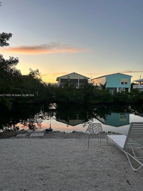 74 Pelican Lane, Unit 1 Big Pine Key, FL 33043 - Photo 6 of 23 a view of a lake with couches and city view
