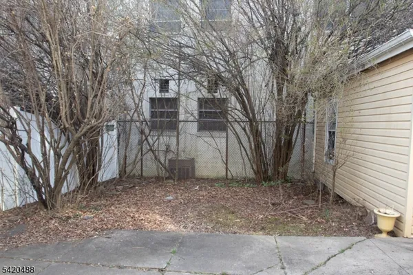 a house view with a backyard space