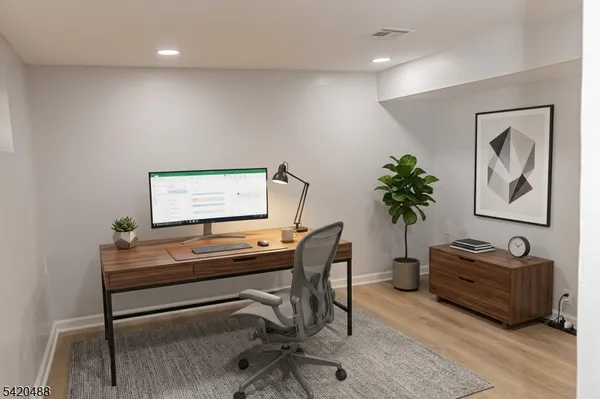 a workspace with furniture and a window