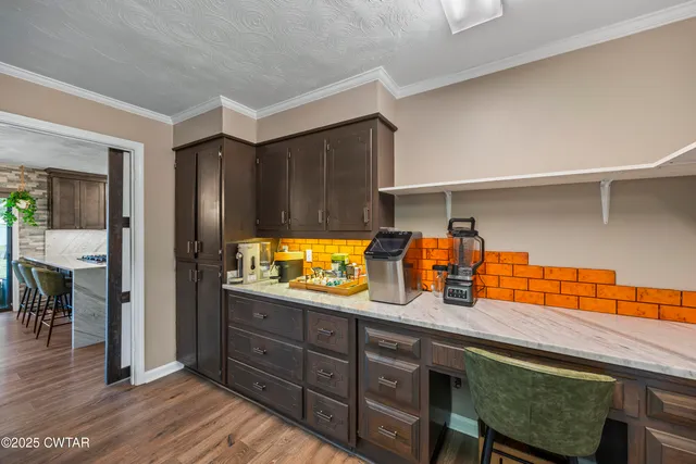 a kitchen with stainless steel appliances granite countertop a sink and a cabinets