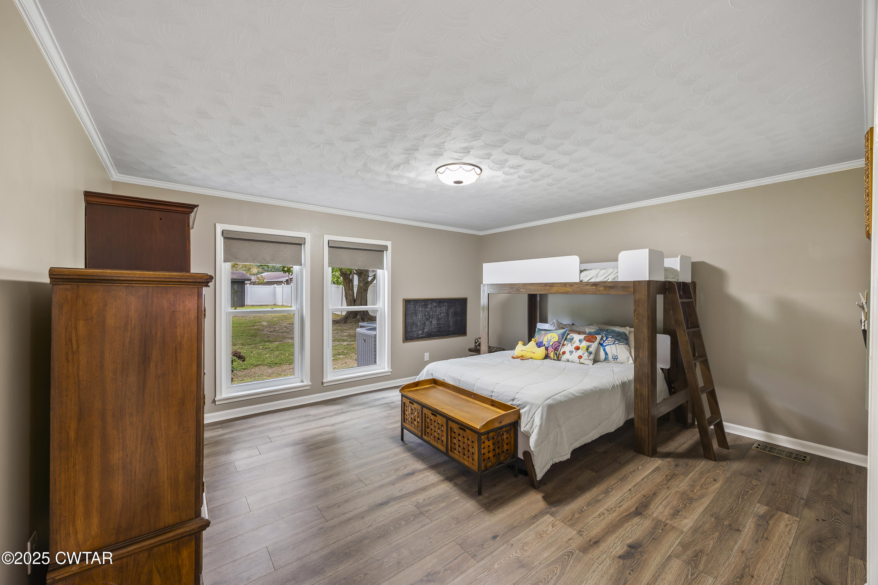 75 Old Humboldt Road Jackson, TN 38305 - Photo 20 of 33 a bedroom with a bed and wooden floor