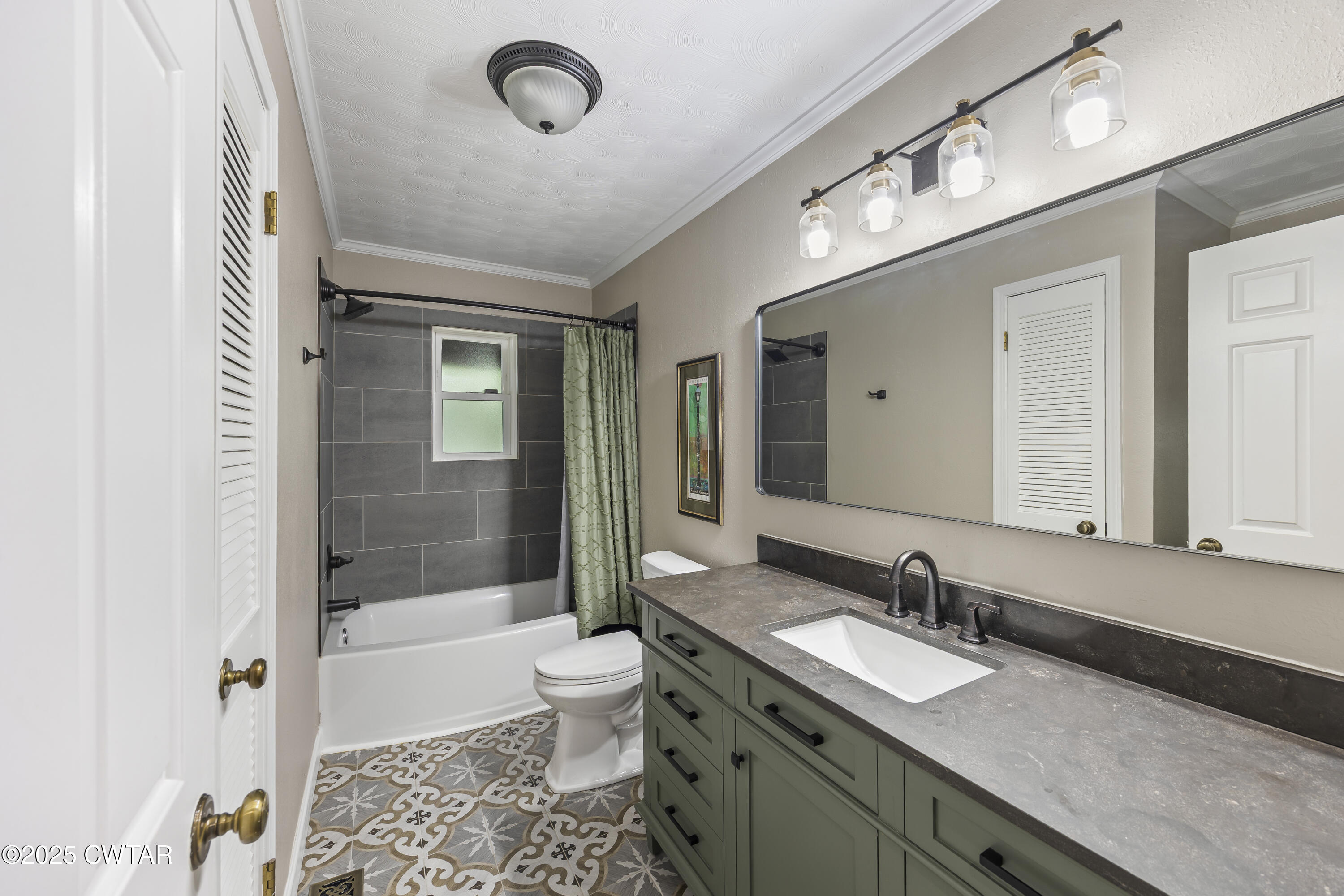 75 Old Humboldt Road Jackson, TN 38305 - Photo 22 of 33 a bathroom with a granite countertop sink a toilet a mirror and bathtub