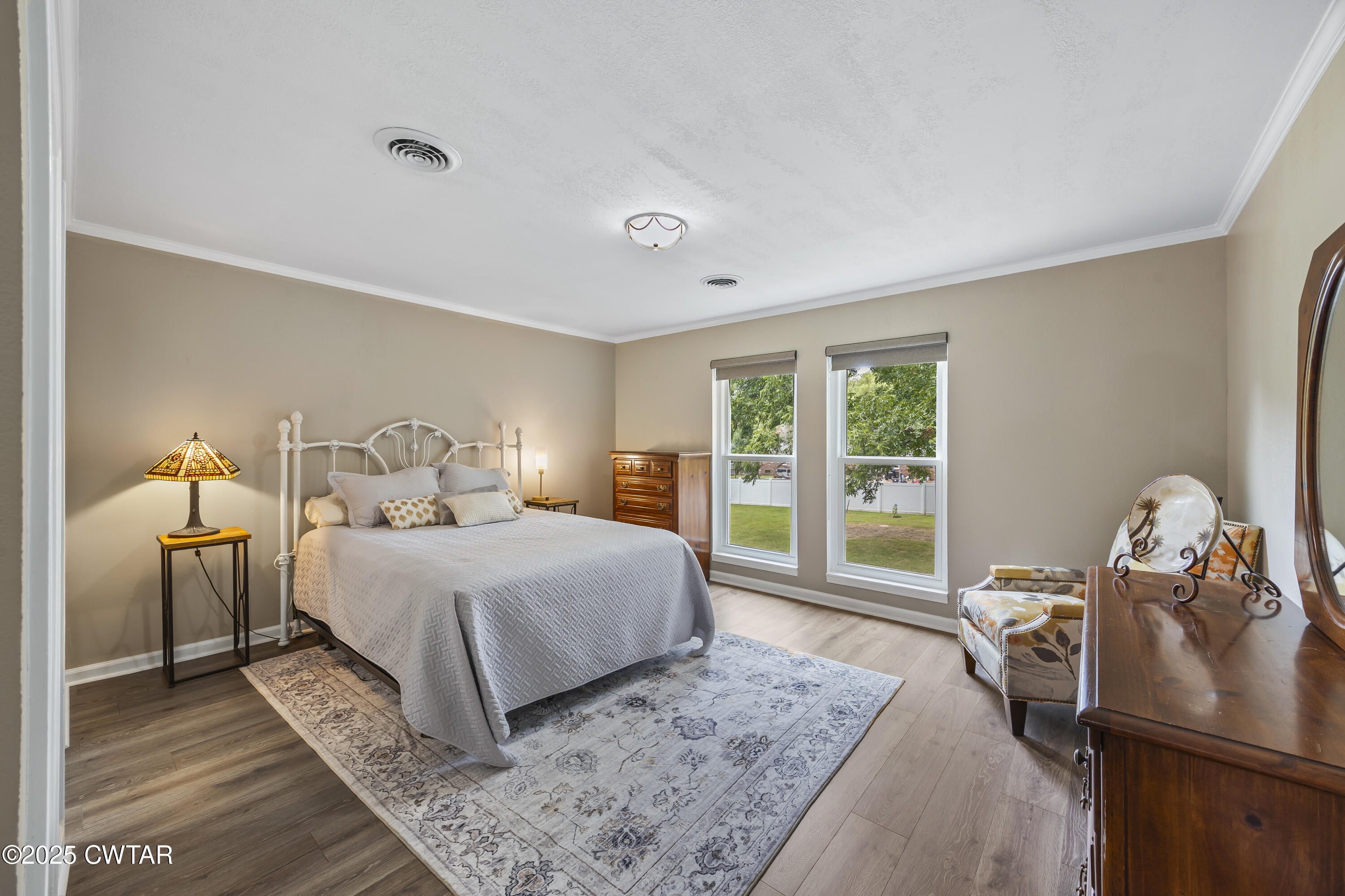 75 Old Humboldt Road Jackson, TN 38305 - Photo 26 of 33 a bedroom with a bed and wooden floor