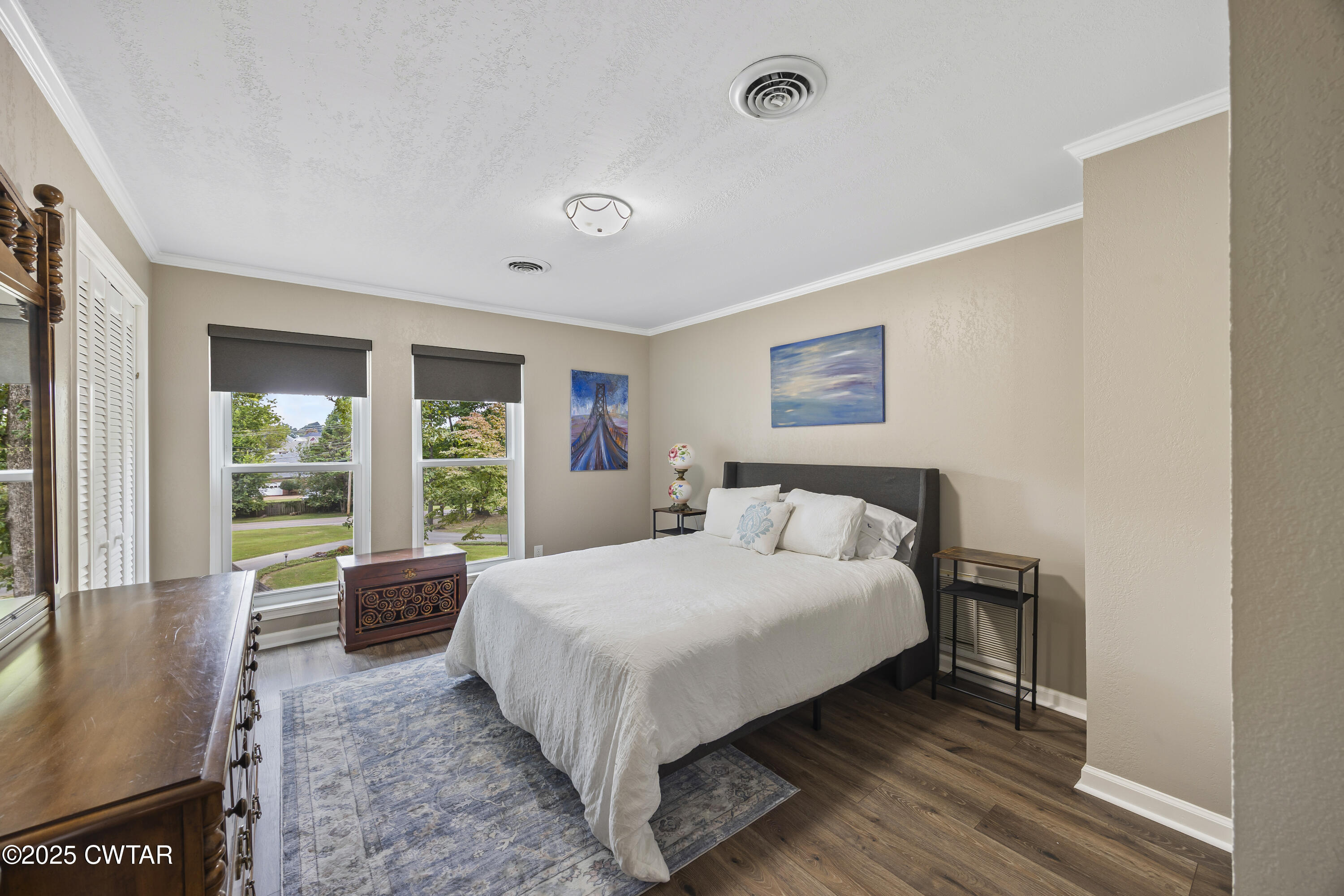 75 Old Humboldt Road Jackson, TN 38305 - Photo 28 of 33 a large bed sitting in a bedroom next to a window