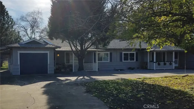 a house with trees in the background
