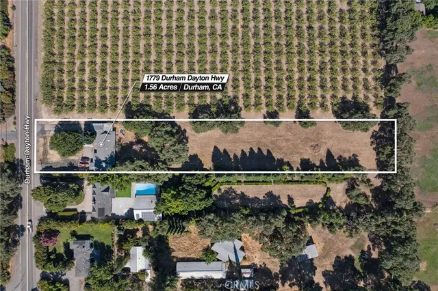 an aerial view of a house with a lake view