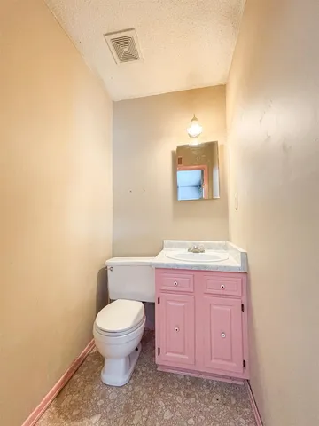 an empty room with a empty space and windows