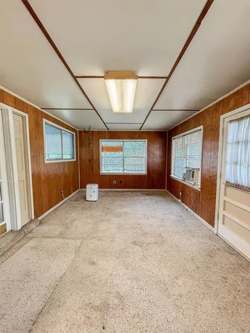 a bedroom with a bed and a table