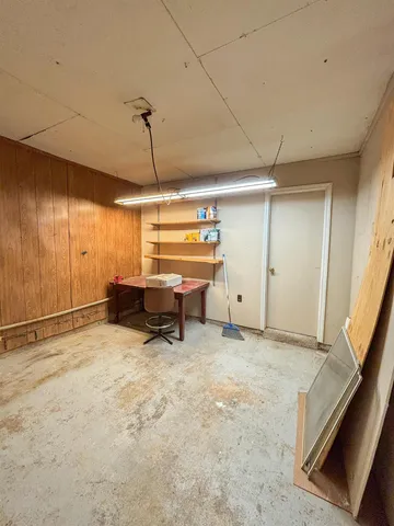 a view of a house with a swimming pool and a yard