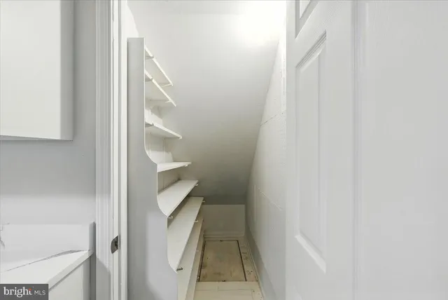 a view of staircase with white walls