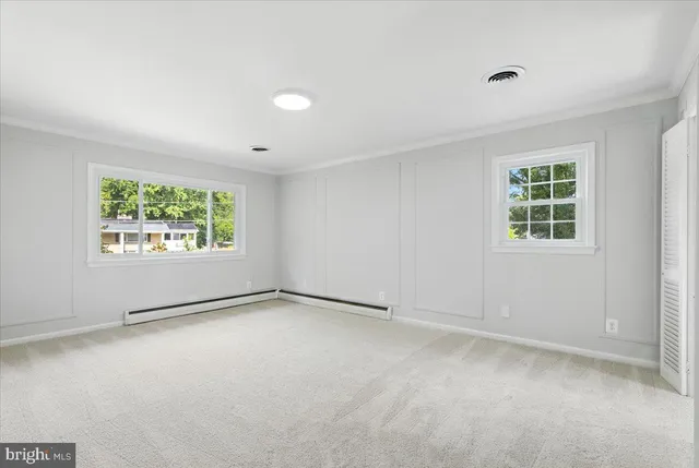 an empty room with windows