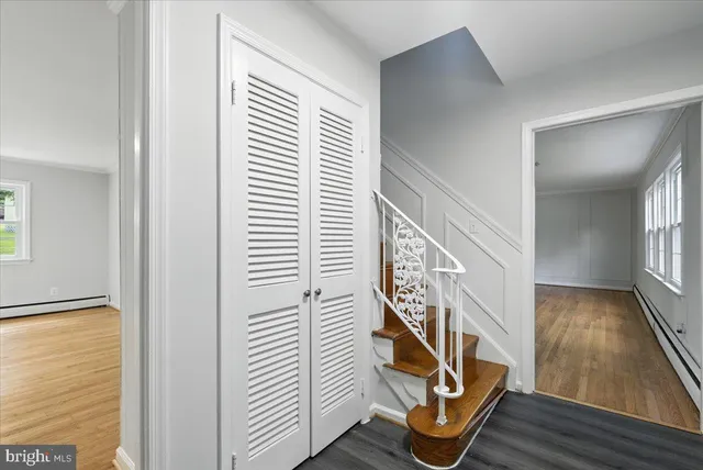 a view of an entryway with wooden floor