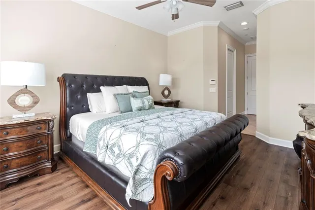 a bathroom with a granite countertop toilet sink and mirror