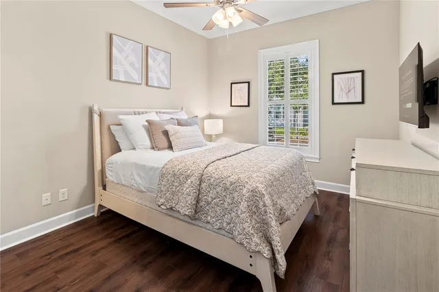 a front view of a house with a tree