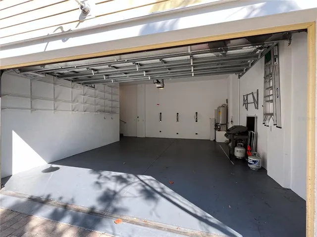 a view of a backyard with a table and chairs