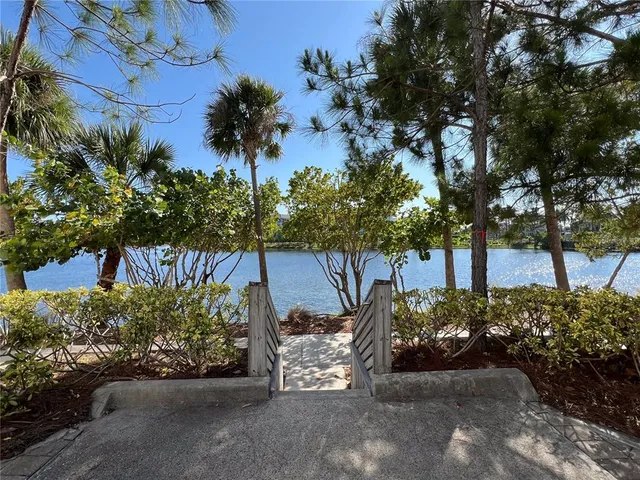 a view of a dining room with a table and chairs
