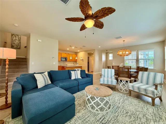 a kitchen with stainless steel appliances granite countertop a stove microwave and sink