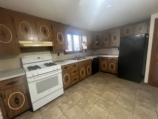 a view of storage and utility room with washer and dryer