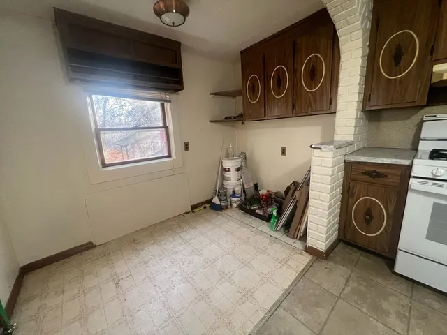 a view of a balcony from an empty room