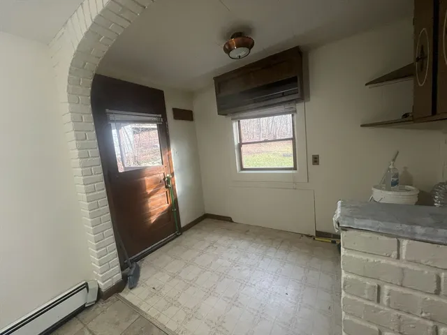 a view of backyard with deck and outdoor seating