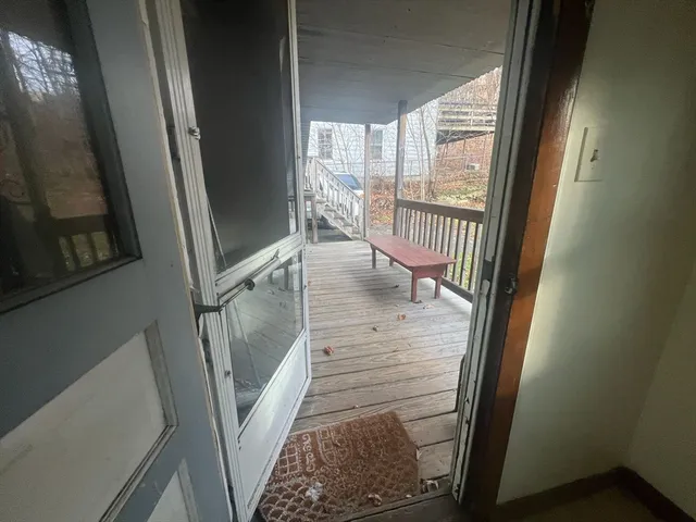 a view of a chair and table in backyard