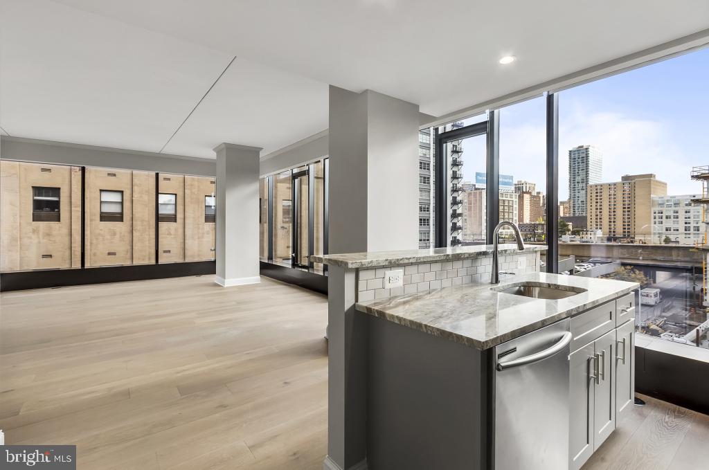 a kitchen with a sink and a large window
