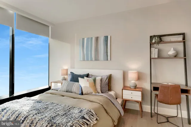 a bedroom with a bed and a chair