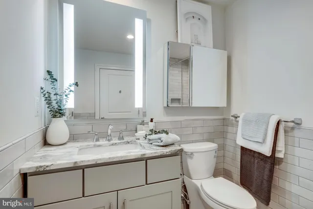 a bathroom with a sink and a washer