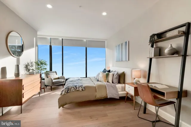 a bedroom with a bed and chair