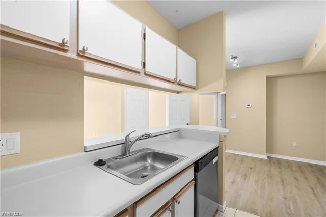 a bathroom with a sink and a window