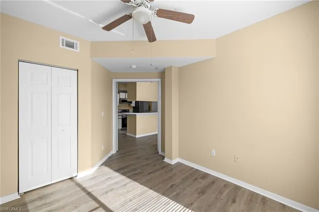 a view of a kitchen from a hallway
