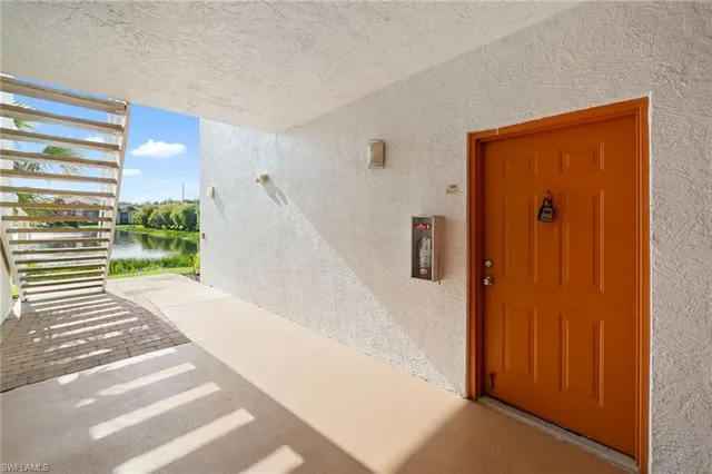 a view of a entryway door with stairs