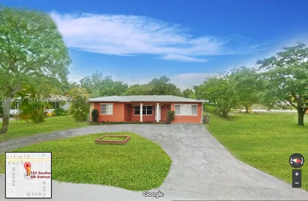 a view of a backyard with a garden