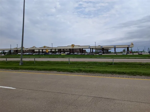 a view of a golf course with a road