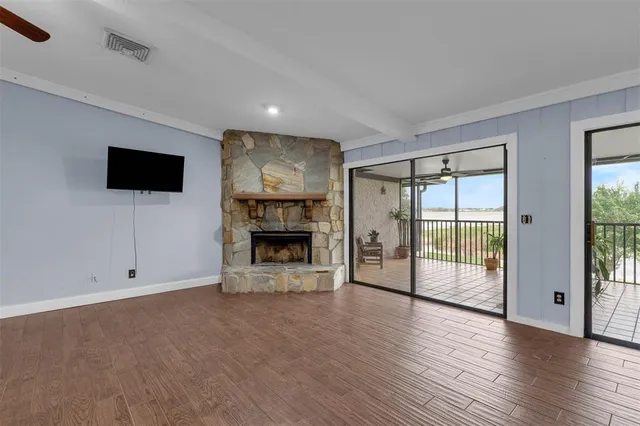 a view of an empty room with glass door