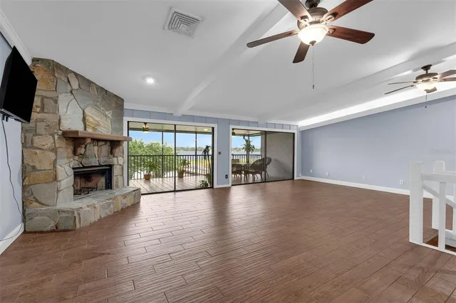 a view of a patio with a dining table and chairs