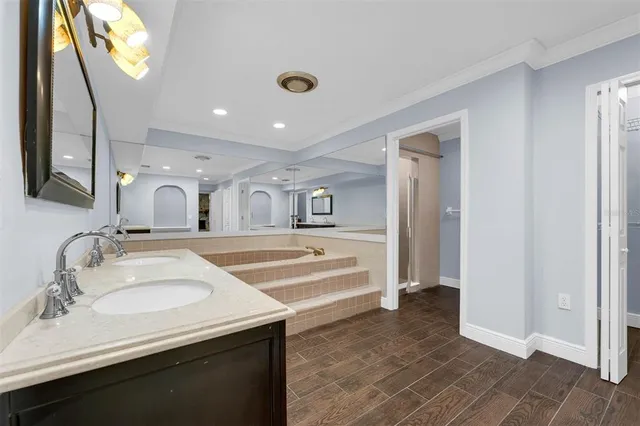a view of hallway with wooden floor