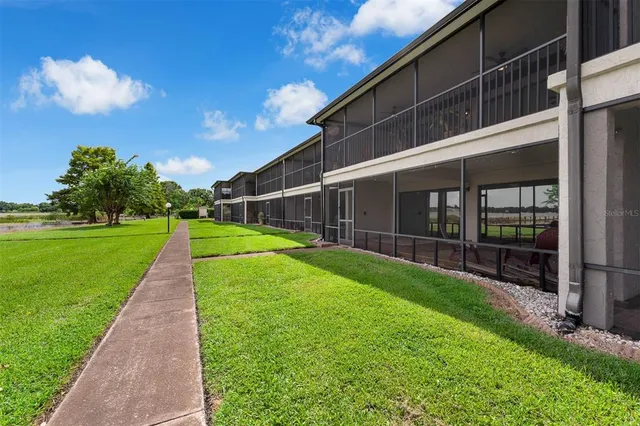a view of a city with lawn chairs and a yard