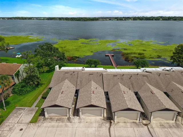 a view of a lake with a house in the background