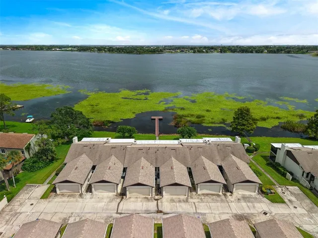 a view of a garden with a building in the background