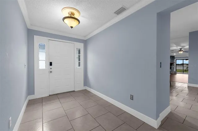 a kitchen with granite countertop a sink counter top space appliances and cabinets
