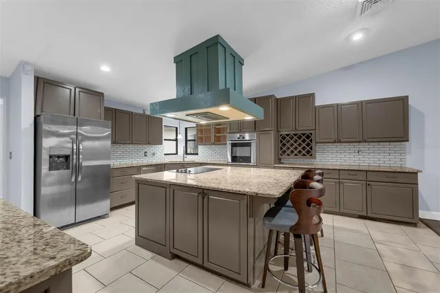 a kitchen with a stove and a microwave