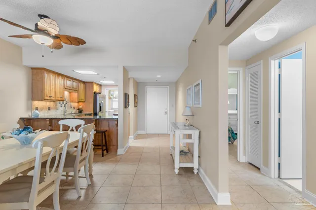 a view of kitchen with furniture and refrigerator