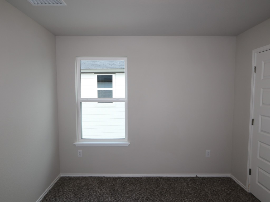 4504 Beacon Bay Drive Austin, TX 78747 - Photo 13 of 31 an empty room with a window