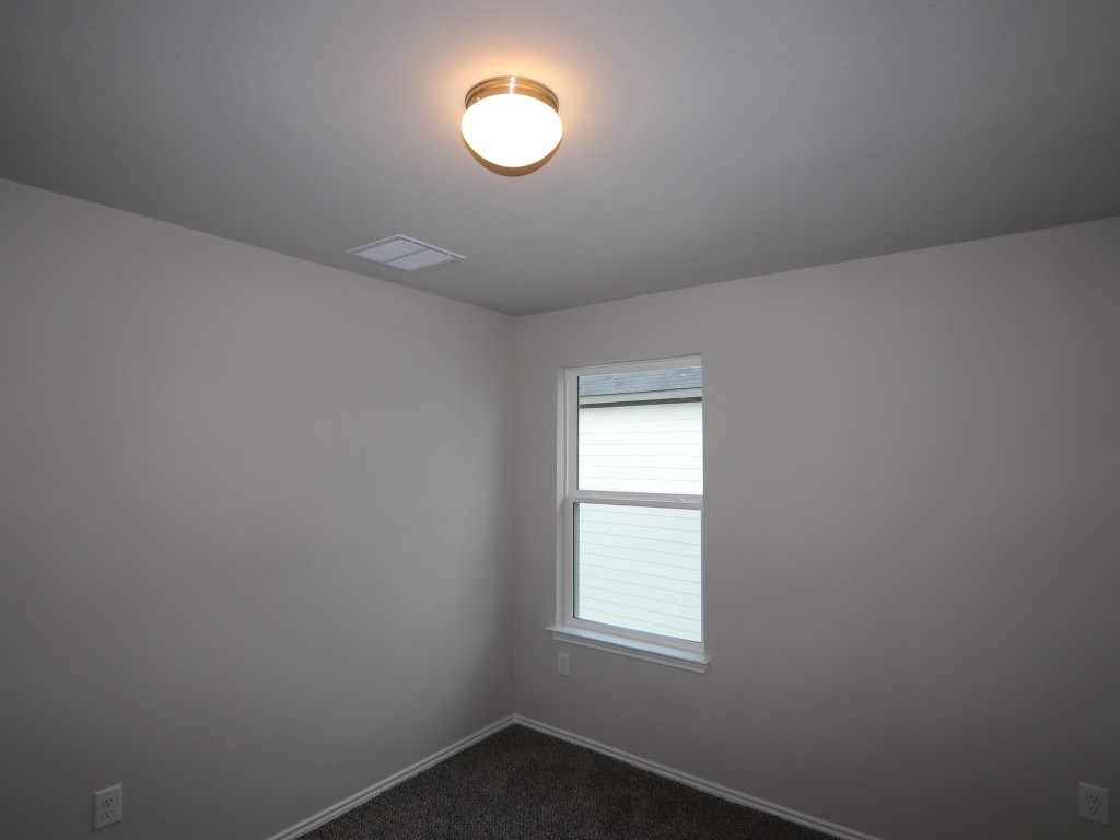 4504 Beacon Bay Drive Austin, TX 78747 - Photo 14 of 31 an empty room with a window