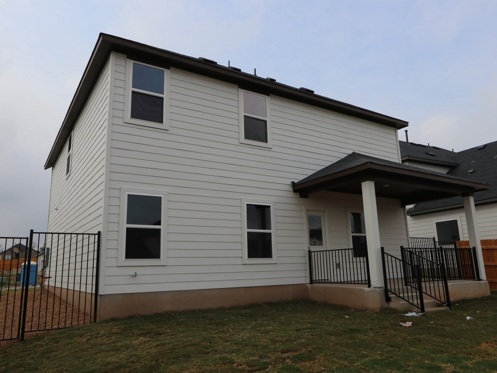 4504 Beacon Bay Drive Austin, TX 78747 - Photo 19 of 31 a front view of a house with a yard