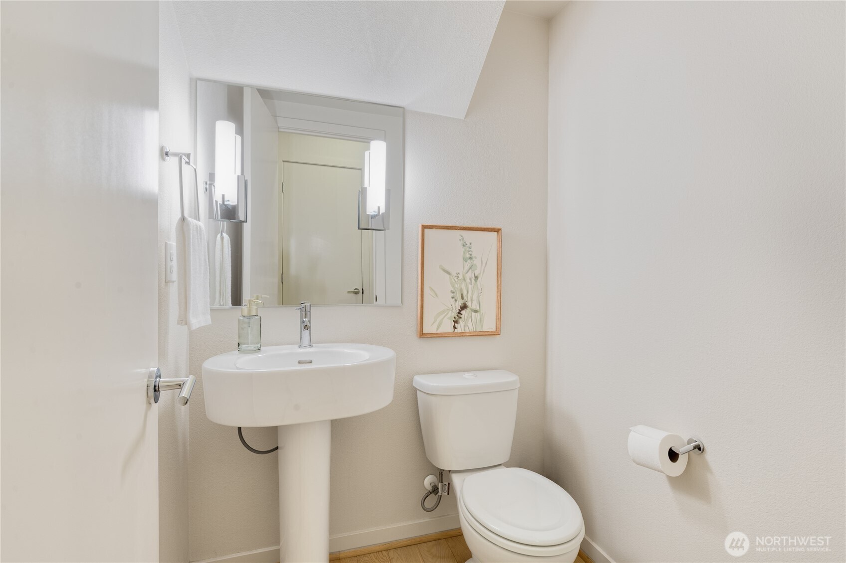 4272 Southwest Bradford Street Seattle, WA 98116 - Photo 13 of 28 a bathroom with a toilet sink and mirror