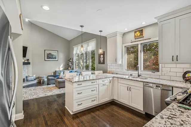 a kitchen with a sink stove and refrigerator