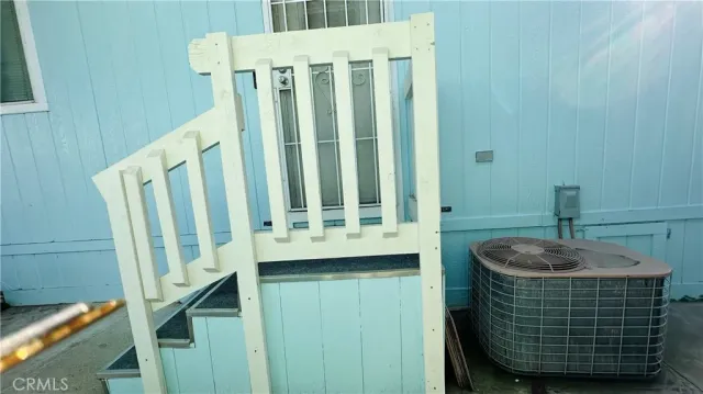 a room with table and stairs